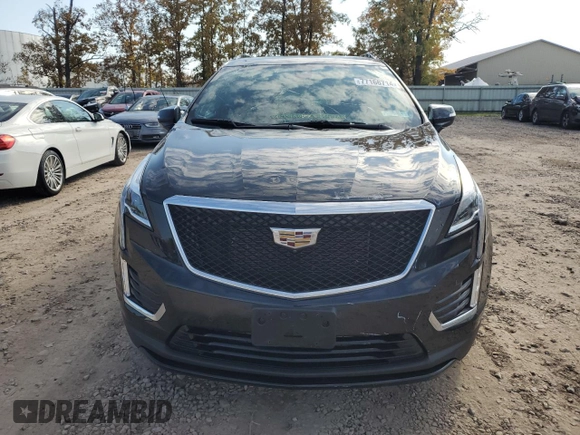2021 Cadillac XT5 AWD Sport with VIN 1GYKNHRS3MZ103180, listed as a Copart auction lot 77166714 with 17,659 mi miles and Salvage title. Bid and sale history available at DreamBid. Image 5.