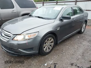 2011 Ford Taurus SE with VIN 1FAHP2DW2BG181059, listed as a IAAI auction lot 42036867 with 103,394 mi miles. Bid and sale history available at carsss.com. Image 2.