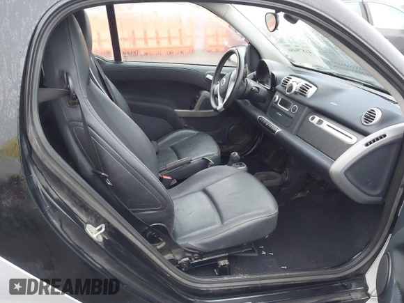 2015 Smart fortwo Passion with VIN WMEEJ3BA9FK819985, listed as a IAAI auction lot 41879486 with 79,394 mi miles. Bid and sale history available at carsss.com. Image 5.
