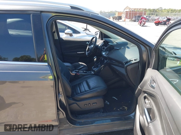 2016 Ford Escape Titanium with VIN 1FMCU0J95GUB11995, listed as a IAAI auction lot 42065255 with 142,390 mi miles. Bid and sale history available at carsss.com. Image 5.