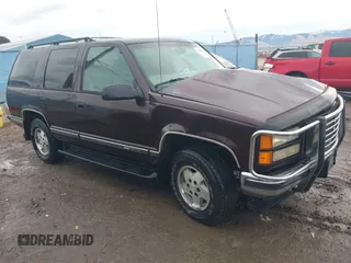 1997 GMC Yukon with VIN 1GKEK13R0VJ755574, listed as a IAAI auction lot 41158932 with 212,668 mi miles. Bid and sale history available at carsss.com. Image 1.