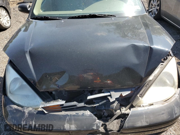 2004 Ford Focus ZTW with VIN 1FAFP35Z84W203676, listed as a Copart auction lot 57272835 with 183,115 mi miles and Salvage title. Bid and sale history available at DreamBid. Image 11.