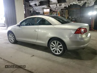 2009 Volkswagen Eos Komfort with VIN WVWBA71F69V019864, listed as a Copart auction lot 52378095 with 142,774 mi miles and Salvage Title. Bid and sale history available at DreamBid. Image 2.