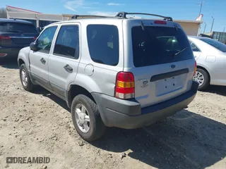 2003 Ford Escape XLT Popular with VIN 1FMYU03103KC87839, listed as a IAAI auction lot 41831997 with 241,204 mi miles. Bid and sale history available at carsss.com. Image 3.