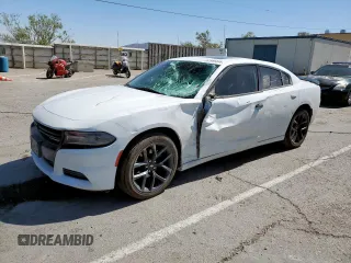 2019 Dodge Charger SXT with VIN 2C3CDXBGXKH753882, listed as a Copart auction lot 57959255 with 146,432 mi miles and Salvage title. Bid and sale history available at DreamBid. Image 1.