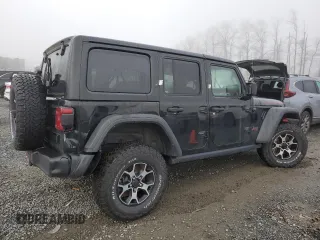 2021 Jeep Wrangler Unlimited Rubicon with VIN 1C4JJXFM7MW818199, listed as a Copart auction lot 87428474 with 18,696 mi miles and Salvage Title. Bid and sale history available at carsss.com. Image 3.