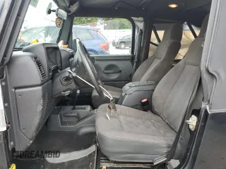 2005 Jeep Wrangler Unlimited with VIN 1J4FA44S75P358246, listed as a Copart auction lot 60958695 with 150,003 mi miles and Salvage title. Bid and sale history available at DreamBid. Image 7.