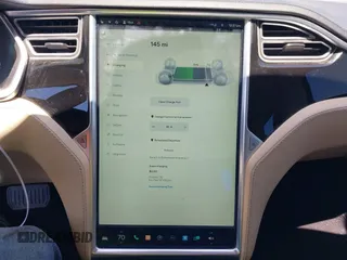 2014 Tesla Model S 60 with VIN 5YJSA1H18EFP31969, listed as a IAAI auction lot 42312485 with 90,043 mi miles and . Bid and sale history available at DreamBid. Image 18.