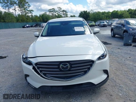 2022 Mazda CX-9 Touring z VIN JM3TCBCY7N0600787, wystawiony jako IAAI lot #42240512 z przebiegiem 27 927 mil mil oraz . Historia ofert i sprzedaży dostępna na DreamBid. Obrazek 12.