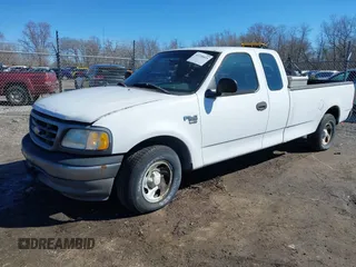 2002 Ford F-150 XL with VIN 1FTRX17L72NA76720, listed as a IAAI auction lot 41738935 with 92,506 mi miles. Bid and sale history available at carsss.com. Image 2.