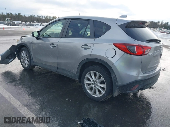 2014 Mazda CX-5 Grand Touring with VIN JM3KE2DY8E0304911, listed as a IAAI auction lot 41672197 with 77,523 mi miles. Bid and sale history available at carsss.com. Image 3.