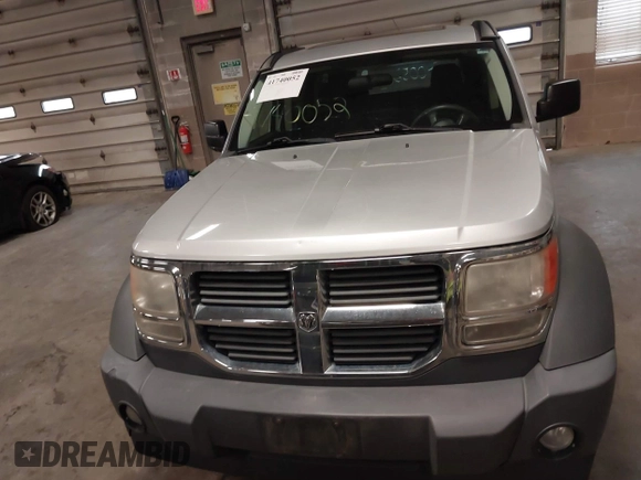 2007 Dodge Nitro SXT with VIN 1D8GU28K47W569317, listed as a IAAI auction lot 41740052 with 220,265 mi miles. Bid and sale history available at carsss.com. Image 12.
