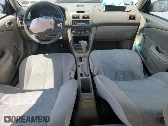1999 Toyota Corolla VE z VIN 2T1BR12E3XC107587, wystawiony jako Copart lot #62314265 z przebiegiem 143 734 mil mil oraz Szkoda całkowita • Salvage title. Historia ofert i sprzedaży dostępna na DreamBid. Obrazek 8.