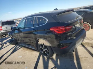 2016 BMW X1 xDrive28i with VIN WBXHT3C36GP880207, listed as a Copart auction lot 82597924 with 145,444 mi miles and Salvage Title. Bid and sale history available at carsss.com. Image 2.