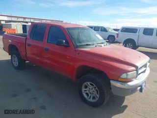 2002 Dodge Dakota SLT with VIN 1B7HG48N32S518455, listed as a IAAI auction lot 41652316 with 234,856 mi miles. Bid and sale history available at carsss.com. Image 1.