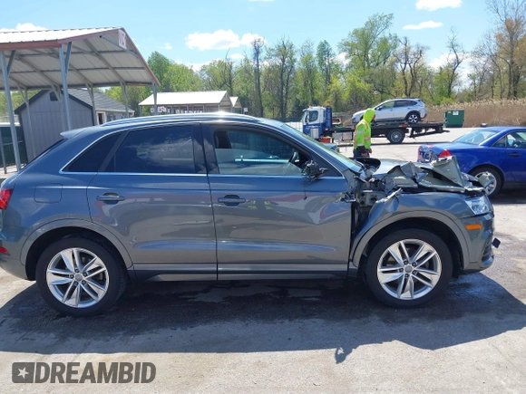 2017 Audi Q3 Premium Plus z VIN WA1JCCFS5HR003127, wystawiony jako IAAI lot #42060877 z przebiegiem 78 881 mil mil oraz . Historia ofert i sprzedaży dostępna na DreamBid. Obrazek 13.
