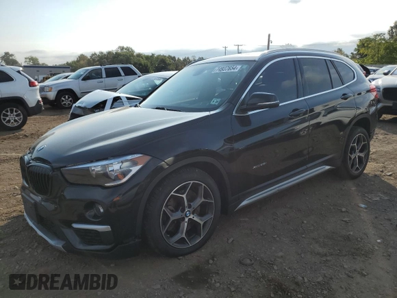 2018 BMW X1 xDrive28i with VIN WBXHT3C33J5F90612, listed as a Copart auction lot 74937654 with 72,561 mi miles and Salvage Title. Bid and sale history available at carsss.com. Image 1.