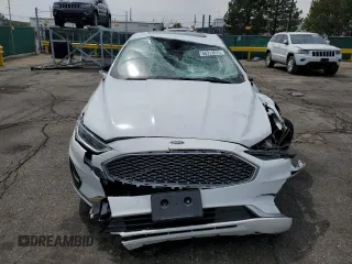 2020 Ford Fusion Titanium z VIN 3FA6P0D96LR205475, wystawiony jako Copart lot #56313075 z przebiegiem 30 888 mil mil oraz Szkoda całkowita • Salvage title. Historia ofert i sprzedaży dostępna na DreamBid. Obrazek 5.