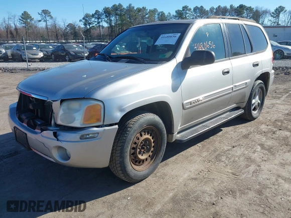 2004 GMC Envoy SLE with VIN 1GKDT13S642213710, listed as a IAAI auction lot 41680656 with 239,187 mi miles. Bid and sale history available at carsss.com. Image 2.