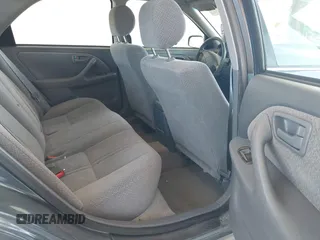 2000 Toyota Camry CE z VIN JT2BG22KXY0406984, wystawiony jako IAAI lot #42344436 z przebiegiem 234 729 mil mil oraz . Historia ofert i sprzedaży dostępna na DreamBid. Obrazek 8.