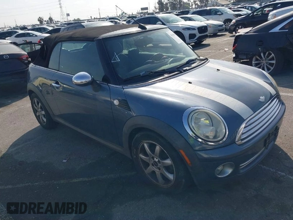 2010 MINI Convertible with VIN WMWMR3C53ATU97865, listed as a IAAI auction lot 41610670 with 154,457 mi miles and . Bid and sale history available at DreamBid. Image 1.