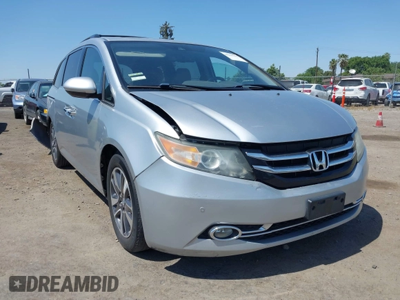 2014 Honda Odyssey Touring with VIN 5FNRL5H91EB068427, listed as a IAAI auction lot 42163315 with 184,134 mi miles and . Bid and sale history available at DreamBid. Image 1.
