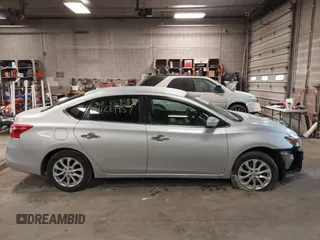 2019 Nissan Sentra S z VIN 3N1AB7AP7KY345072, wystawiony jako IAAI lot #41284957 z przebiegiem 104 084 mil mil oraz . Historia ofert i sprzedaży dostępna na DreamBid. Obrazek 14.