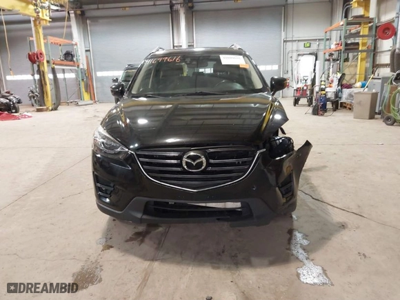 2016 Mazda CX-5 Grand Touring with VIN JM3KE2DY9G0635368, listed as a IAAI auction lot 41699616 with 240,619 mi miles. Bid and sale history available at carsss.com. Image 13.