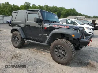2013 Jeep Wrangler Sport z VIN 1C4AJWAG5DL671491, wystawiony jako Copart lot #59306745 z przebiegiem 111 778 mil mil oraz Szkoda całkowita • Salvage title. Historia ofert i sprzedaży dostępna na DreamBid. Obrazek 4.
