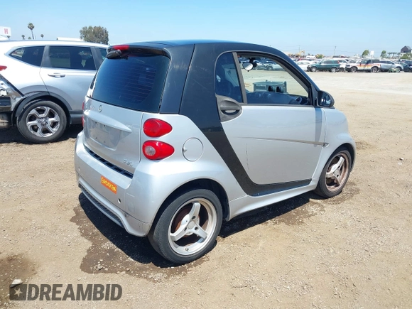 2013 Smart fortwo Pure with VIN WMEEJ3BA8DK619600, listed as a IAAI auction lot 42660006 with Not provided miles and . Bid and sale history available at DreamBid. Image 4.