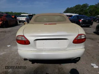 1999 Jaguar XK with VIN SAJGX2043XC040866, listed as a Copart auction lot 53712555 with 65,349 mi miles and Clean Title. Bid and sale history available at DreamBid. Image 6.