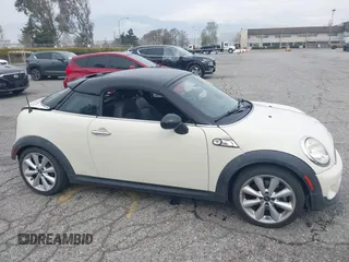 2013 MINI Coupe S with VIN WMWSX3C53DT466648, listed as a IAAI auction lot 41719597 with 106,936 mi miles and . Bid and sale history available at DreamBid. Image 14.