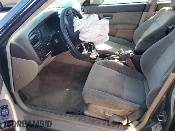2002 Subaru Legacy Outback with VIN 4S3BH665427633764, listed as a Copart auction lot 57443145 with 210,616 mi miles and Salvage title. Bid and sale history available at DreamBid. Image 7.