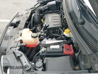 2016 Chevrolet Sonic LT z VIN 1G1JC6SB8G4112151, wystawiony jako IAAI lot #42043930 z przebiegiem 28 556 mil mil oraz . Historia ofert i sprzedaży dostępna na DreamBid. Obrazek 19.