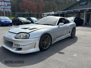 1993 Toyota Supra с VIN JZA800010229, выставлен на аукционе Copart как лот 50000065 с пробегом 130 612 миль миль и Чистый • Clean title. История ставок и продаж доступна на DreamBid. Изображение 2.