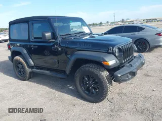 2021 Jeep Wrangler Sport z VIN 1C4GJXAN7MW796019, wystawiony jako IAAI lot #42172407 z przebiegiem 34 128 mil mil oraz . Historia ofert i sprzedaży dostępna na DreamBid. Obrazek 1.