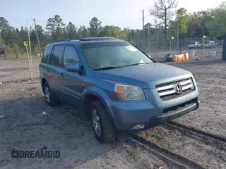 2006 Honda Pilot EX-L with VIN 5FNYF18516B002860, listed as a IAAI auction lot 41963343 with 202,799 mi miles and . Bid and sale history available at carsss.com. Image 1.