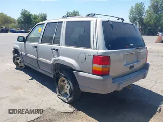1997 Jeep Grand Cherokee Laredo z VIN 1J4GZ58S4VC720943, wystawiony jako IAAI lot #42648807 z przebiegiem 231 203 mil mil oraz . Historia ofert i sprzedaży dostępna na DreamBid. Obrazek 3.