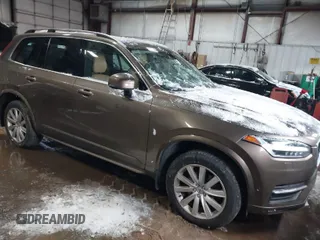 2016 Volvo XC90 T6 Momentum with VIN YV4A22PK6G1022376, listed as a IAAI auction lot 41595150 with 128,877 mi miles. Bid and sale history available at carsss.com. Image 1.