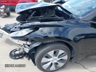 2023 Tesla Model Y Long Range z VIN 7SAYGDEE2PF863200, wystawiony jako IAAI lot #41805168 z przebiegiem 25 480 mil mil oraz . Historia ofert i sprzedaży dostępna na DreamBid. Obrazek 21.