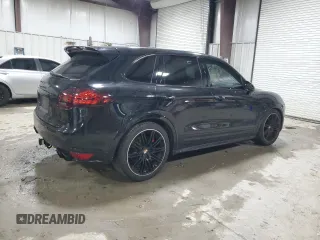 2012 Porsche Cayenne Turbo z VIN WP1AC2A21CLA84144, wystawiony jako Copart lot #82688294 z przebiegiem 124 143 mil mil oraz Szkoda całkowita • Salvage title. Historia ofert i sprzedaży dostępna na DreamBid. Obrazek 3.