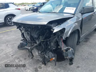 2013 Dodge Journey SE with VIN 3C4PDCAB3DT626929, listed as a IAAI auction lot 42318702 with Not provided miles and . Bid and sale history available at DreamBid. Image 14.