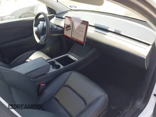 2021 Tesla Model Y Long Range with VIN 5YJYGDEE0MF265339, listed as a IAAI auction lot 41975058 with 51,292 mi miles and . Bid and sale history available at DreamBid. Image 5.