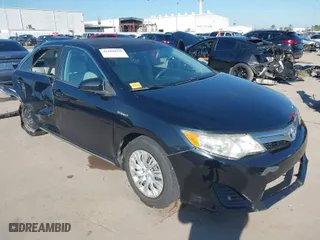2013 Toyota Camry Hybrid LE with VIN 4T1BD1FK6DU070138, listed as a IAAI auction lot 41668658 with 148,065 mi miles. Bid and sale history available at carsss.com. Image 1.