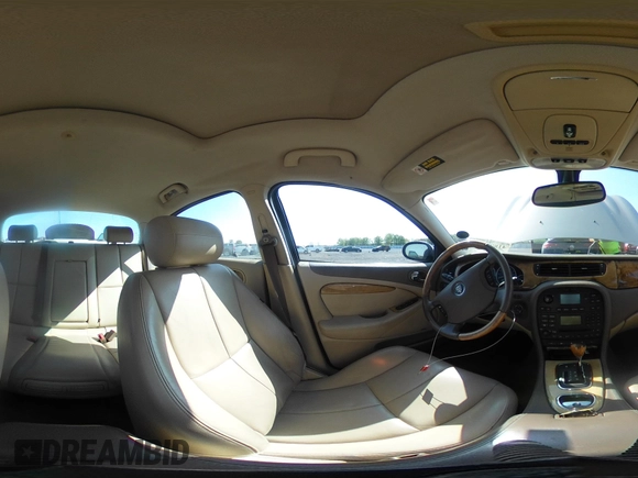 2005 Jaguar S-Type with VIN SAJWA01T95FN22745, listed as a IAAI auction lot 41898269 with 57,614 mi miles and . Bid and sale history available at DreamBid. Image 18.