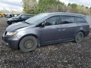 2014 Honda Odyssey Touring with VIN 5FNRL5H98EB512144, listed as a Copart auction lot 69987533 with 184,231 mi miles and Salvage title. Bid and sale history available at DreamBid. Image 1.