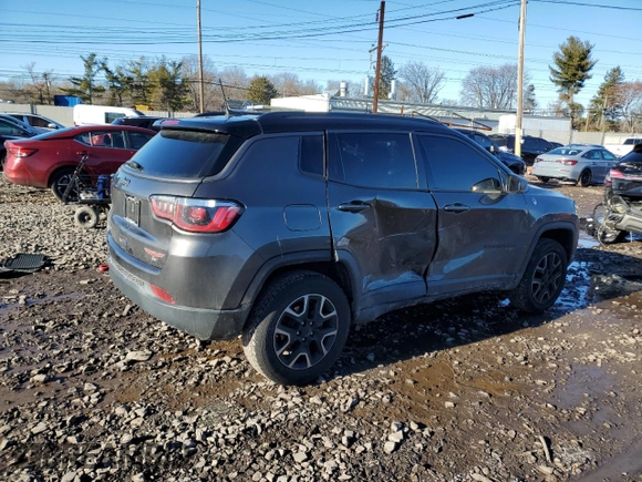 2019 Jeep Compass Trailhawk with VIN 3C4NJDDB5KT775860, listed as a Copart auction lot 48113695 with 76,091 mi miles and Salvage Title. Bid and sale history available at DreamBid. Image 3.