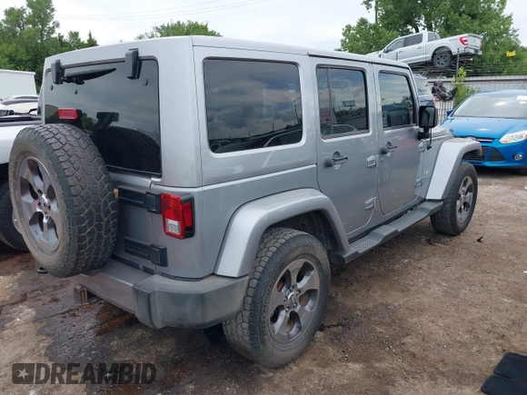 2016 Jeep Wrangler Unlimited Sahara z VIN 1C4BJWEGXGL280016, wystawiony jako IAAI lot #42620102 z przebiegiem 128 232 mil mil oraz . Historia ofert i sprzedaży dostępna na DreamBid. Obrazek 4.
