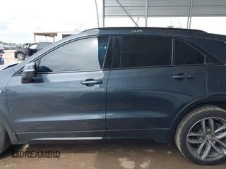 2019 Cadillac XT4 FWD Sport z VIN 1GYFZER49KF215843, wystawiony jako IAAI lot #41912861 z przebiegiem 102 922 mil mil oraz . Historia ofert i sprzedaży dostępna na DreamBid. Obrazek 14.