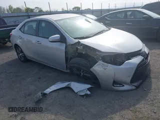 2018 Toyota Corolla L z VIN 5YFBURHEXJP758663, wystawiony jako IAAI lot #41912846 z przebiegiem 86 519 mil mil oraz . Historia ofert i sprzedaży dostępna na DreamBid. Obrazek 1.